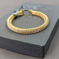 3 Row open memory crystal bracelet encased in wire mesh